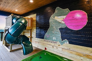 Be LEGENDARY and take a photo with our dinosaur mural on the lower level deck. Slide, rock wall, putt putt, games, lounge, flat screen, and more!