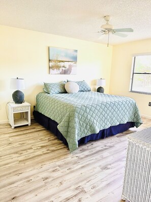 Master bedroom with king bed and sliding glass door to Lanai