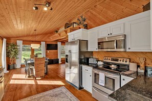 Fully stocked kitchen with stainless steel appliances and everything you'll need to make a home cooked meal