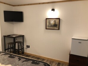 Table and mini refrigerator in your room.