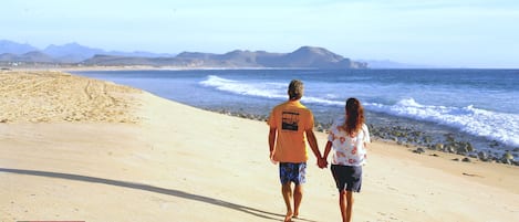 Walking on the beach in front of the property