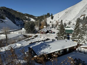 The green roof on right is Building A where your room is located.