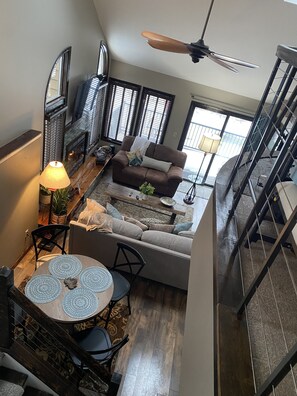 Looking down into living room and kitchen table.