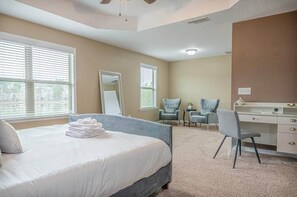 Master bedroom with a desk and sitting area