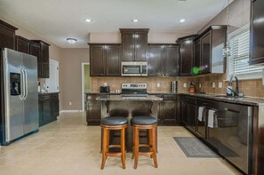 Spacious kitchen with counter seating