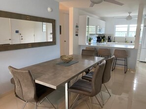 Spacious Dining table that seat 7 plus 3 bar stools at the kitchen bar.