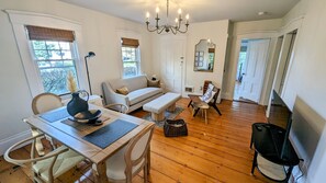 Charming dining area with cozy seating for four and plenty of natural lighting. 