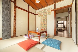 This versatile tatami room doubles as a cosy lounge or extra sleeping space, complete with decor
