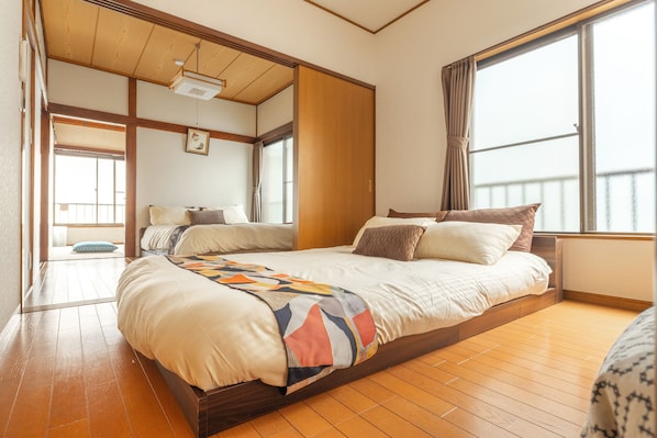 Two restful sleeping spaces with a seamless flow between traditional and modern design