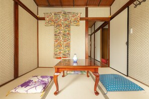 Soak in the serenity of this classic tatami room, with elegant kimono art