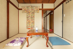 Soak in the serenity of this classic tatami room, with elegant kimono art