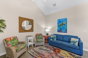 Open concept living, dining, and kitchen area with cozy seating for the whole family