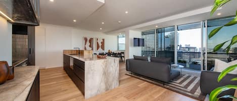 Luxe living, kitchen and dining area