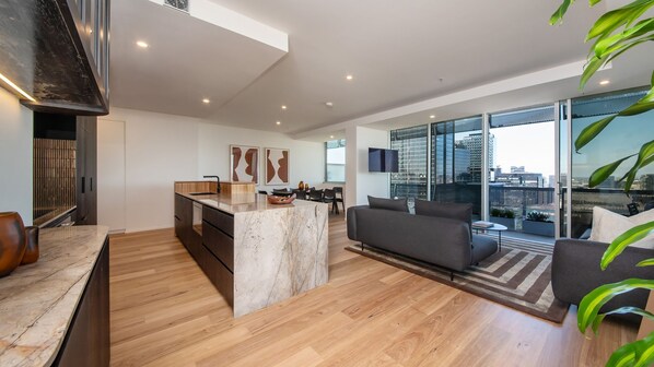 Luxe living, kitchen and dining area