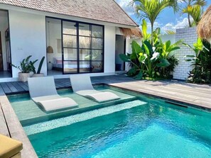 Cool off in our submerged pool lounge chairs.