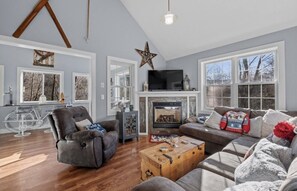 Cozy living area to watch tv or read a book in front of the fire place.