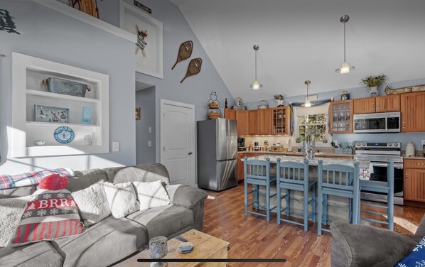 Bright and open kitchen and 1st living room area.