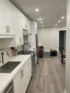 Entrance takes you past the laundry and closet into the kitchen.