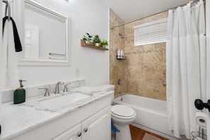 Enjoy a soaking bath or peaceful shower in this larger second bathroom. 