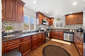 Make a masterful meal in this large kitchen; easy to navigate and serve.