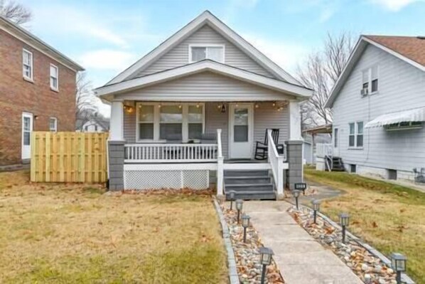 Welcome to our stunning home! The exterior radiates charm, surrounded by lush landscaping.