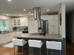 Full kitchen for entertaining quartz counters and stainless appliances