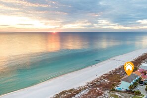 See your spot marked! Aerial View of Sunsets at SplashPad PCB featuring its famous emerald waters