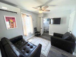 Living area with smart tv, free WIFI. Unit is heated and cooled with split unit.