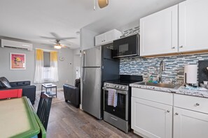 Open kitchen, dining and living area.