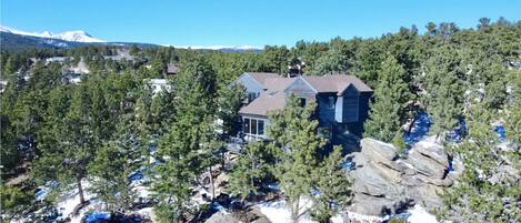 The villa is perched atop granite rocks.