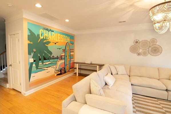 Take photos in front of our Living Room Mural!