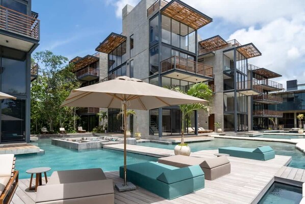 Relax by our stunning pool! Enjoy the sun and tropical breeze.