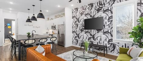 Spacious kitchen & living areas with a Smart TV, comfortable furnishings, and plenty of seating for your group to kick back after exploring the city.