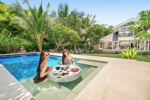 A refreshing dip in your private pool, while savoring a delightful floating breakfast