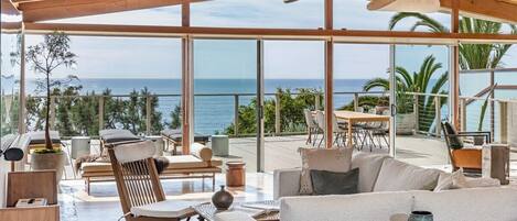 Lounge in the living space, where panoramic ocean views blend classic architecture with modern luxury.