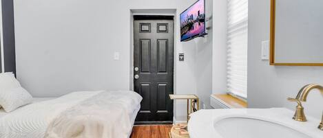 Smart Sanctuary Suite: Your stylish one-bedroom escape, where the allure of a smart TV and the convenience of a mini-fridge redefine modern comfort