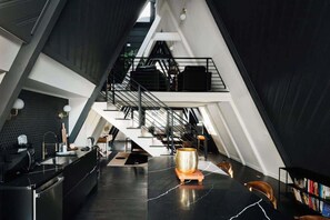 Kitchen looking at loft, dining, and living areas