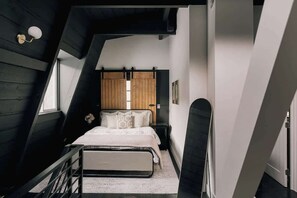 Primary loft bedroom with queen bed