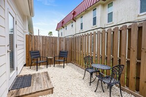 Back patio area with comfortable seating, perfect for entertaining