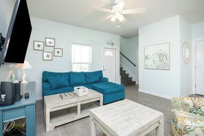 Living area with queen size sofa sleeper and flat screen TV