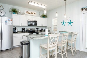Beautiful modern kitchen and breakfast bar with bar stools, perfect for entertaining