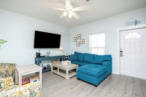 Bright and airy living room with cozy seating, ideal for family moments and togetherness
