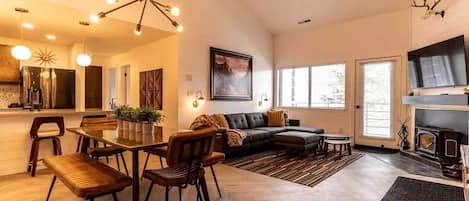 Living area - deck, fireplace, vaulted ceilings