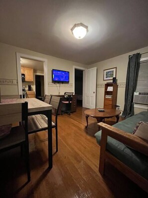 Relax, wind down, watch a movie or finish up the work day in this comfortable living area with a large TV and desk to meet your needs.