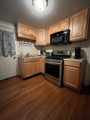 Enjoy this cozy kitchen. It may be modest but its fully equipped to meet your needs.