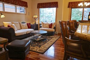 Open View living room with gas fireplace and TV