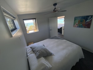 master bedroom 2 with view king bed