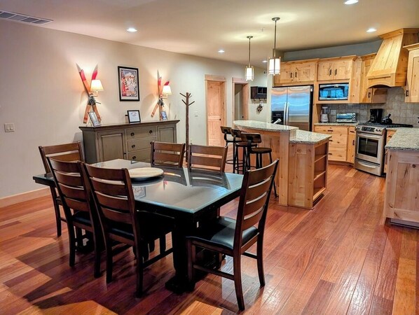 Main dining area and fully equipped kitchen.