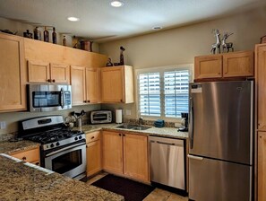 Fully equipped kitchen with stainless steel appliances