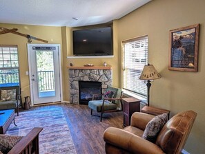 Gas fireplace and reading chair in the living room area.